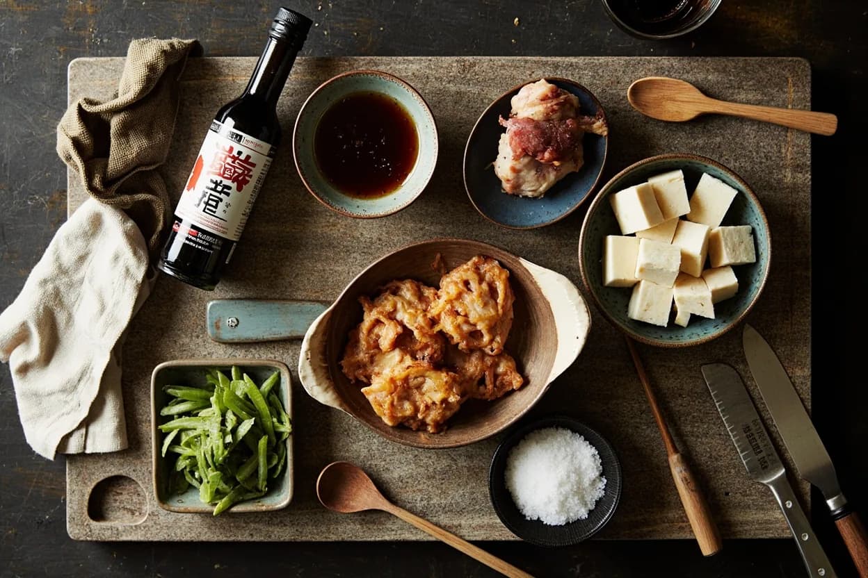 Mise en place for Japanese Izakaya Cuisine: the staple ingredients and key tools of the tradition laid out on the cook's board.