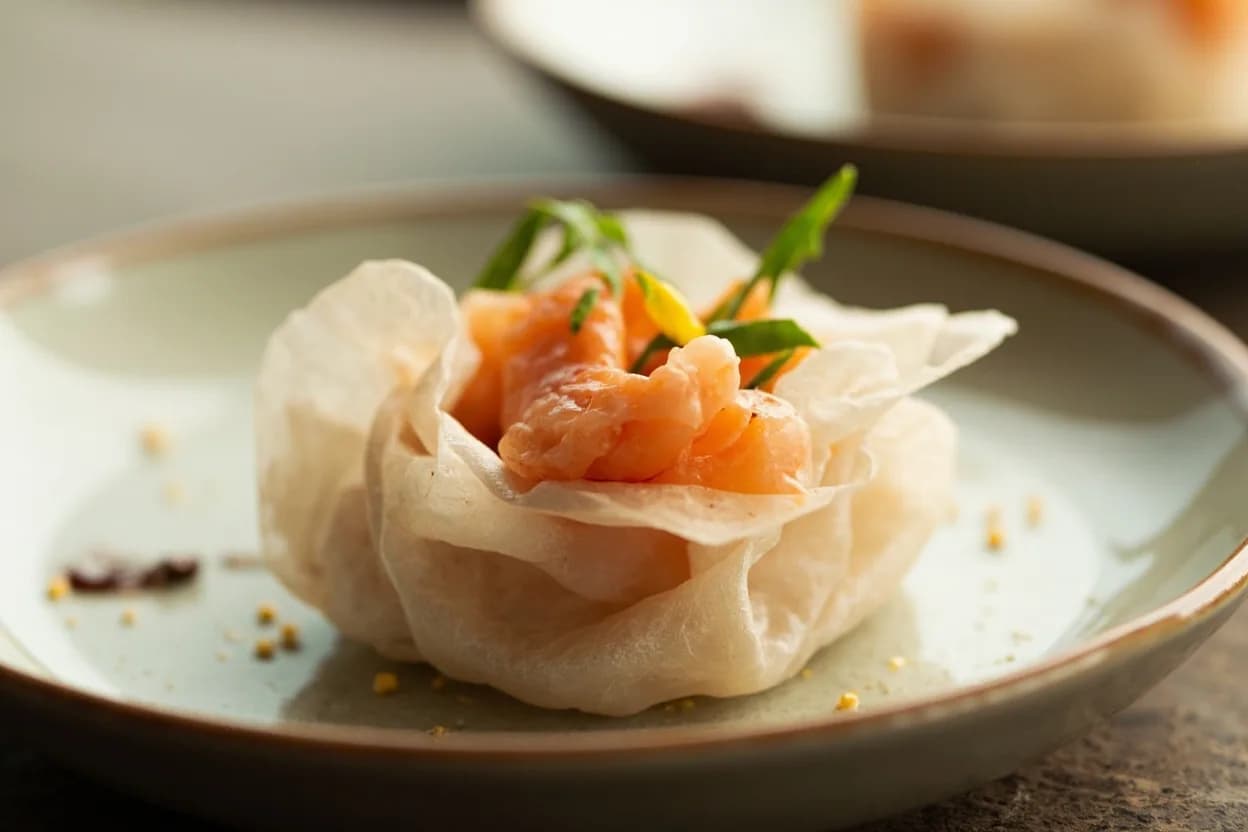 Prawn / Shrimp — Devein & Butterfly Cut prepared the canonical way — Har gow (Cantonese steamed shrimp dumplings). Shell-off devein: peel the shell by pinching and removing from the head end, leaving tail fins attached if desired. Lay the prawn on its side, make a shallow incision (2–3 mm deep) along the entire dorsal curve with the blade tip, then lift and pull out the dark tract with the knife tip or a toothpick.