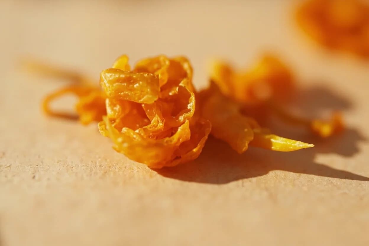 Ají Mirasol in its natural form. Ají mirasol is ají amarillo (Capsicum baccatum var. Tasting profile: dried tropical fruit: raisin, apricot, mango, mild honey sweetness, moderate direct heat (capsaicin-forward, not smoked), light floral note from the dried skin.