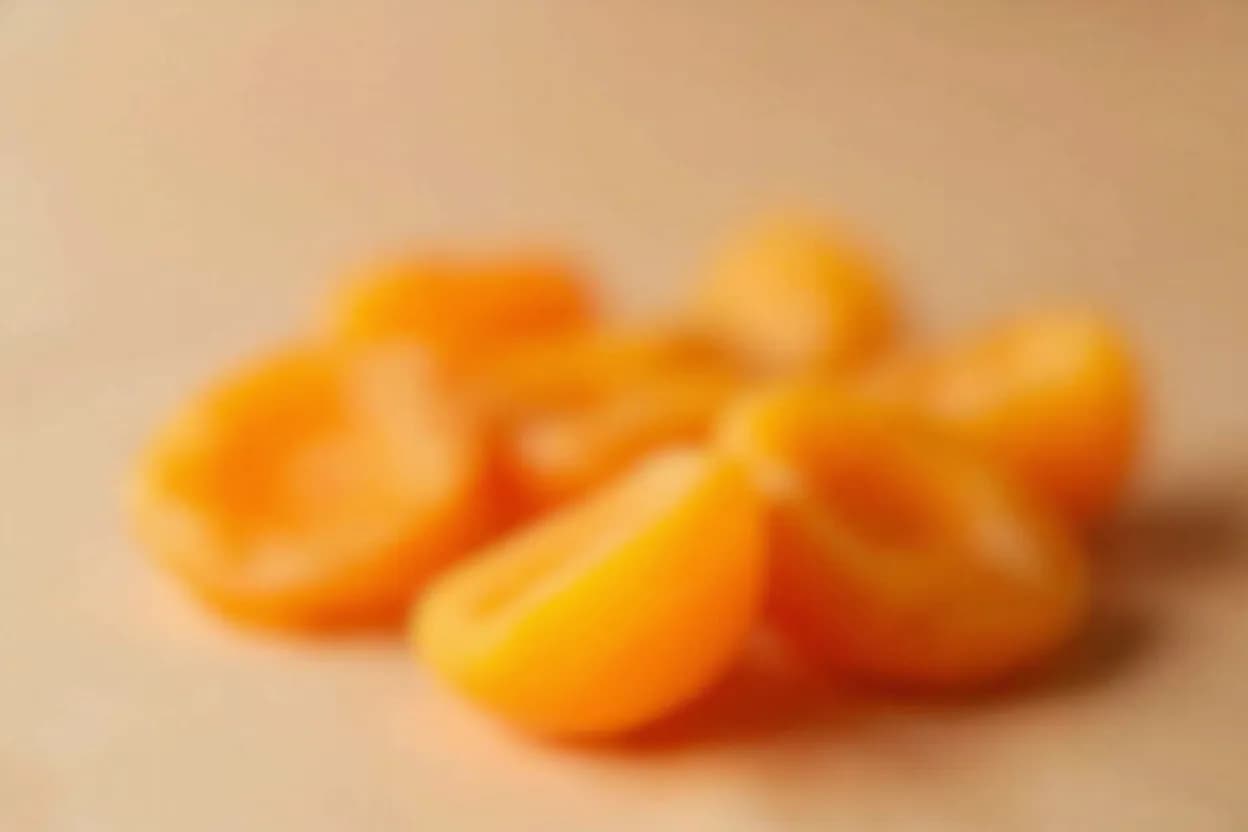 Dried Apricots in its natural form. Dried apricots are ripe apricots (Prunus armeniaca) dried until their water activity drops to a stable shelf-stable level, concentrating sugars, carotenoids, and malic and citric acids. Tasting profile: concentrated tart-sweet stone fruit, floral peach and apricot blossom, high bright acidity (malic, citric), honey undertone.