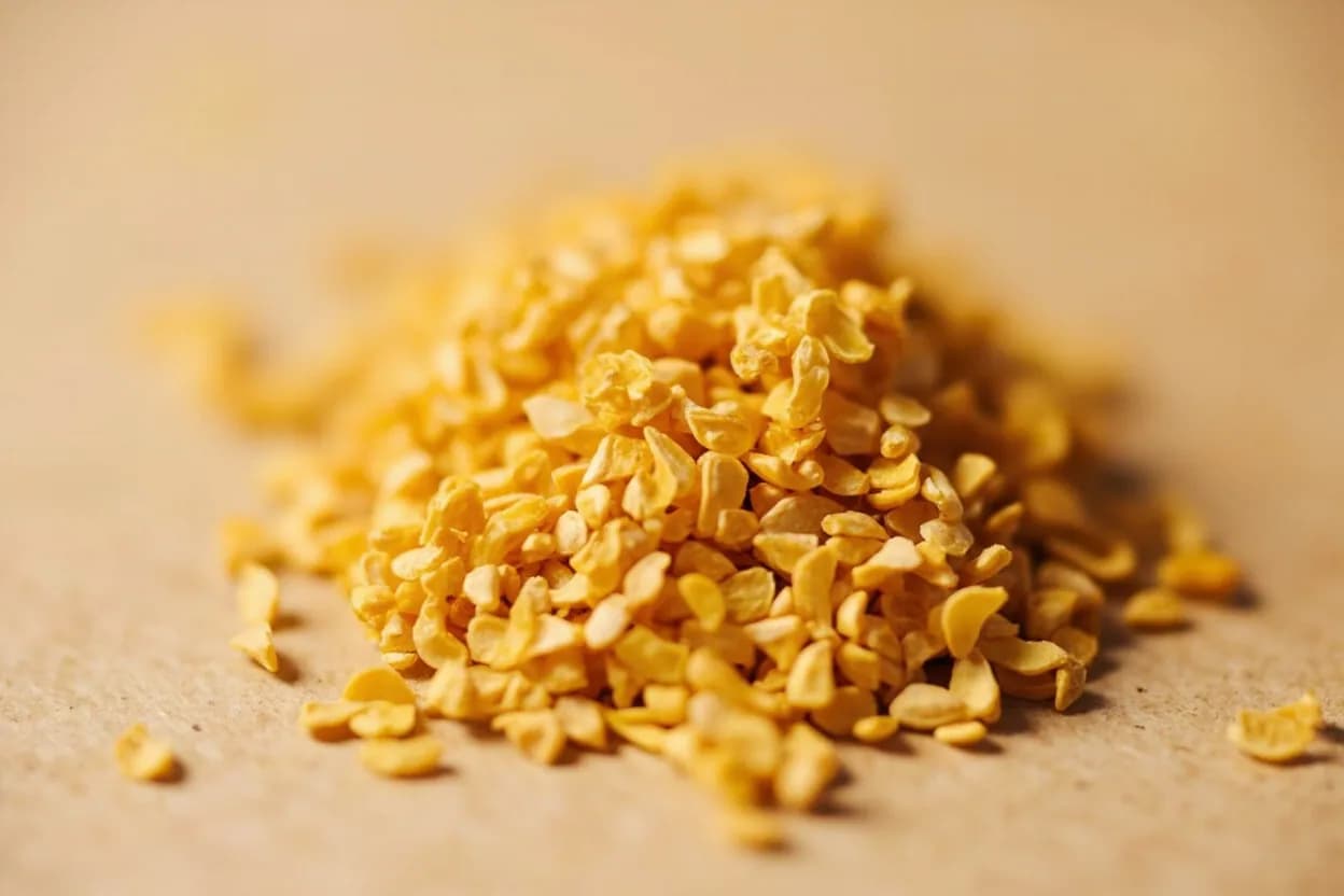 Fenugreek in its natural form. Fenugreek (Trigonella foenum-graecum) is an annual legume whose small, amber, hard-cornered seeds carry one of the most distinctive aromatic profiles in the spice world. Tasting profile: Maple syrup sweetness (sotolon), Pronounced bitter edge — almost celery-bitter when raw, Caramel undertone when gently toasted, Faint celery / lovage savoriness.