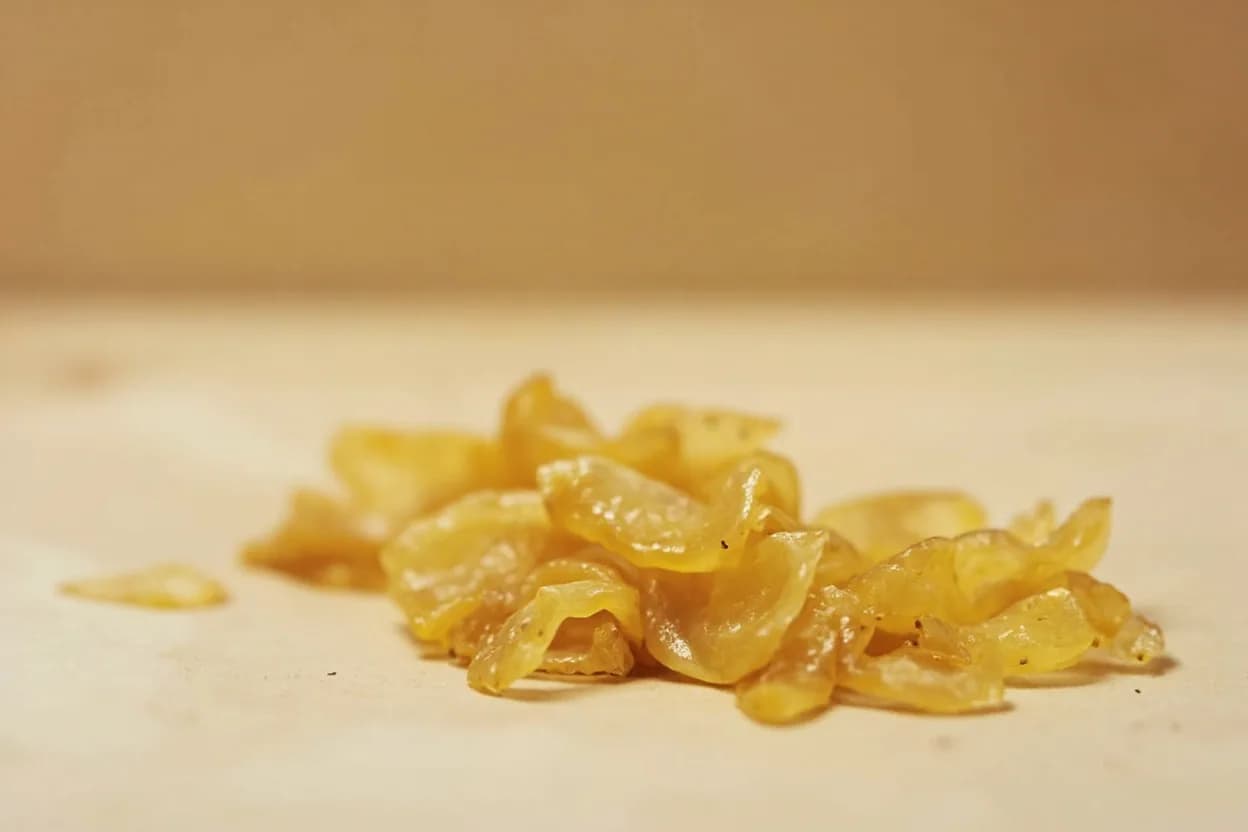 Pickled Ginger (Gari) in its natural form. Gari is young ginger (shin-shoga) sliced paper-thin and pickled in a brine of rice vinegar and sugar, sometimes with a touch of salt. Tasting profile: sharp, clean ginger heat (gingerol → shogaol under acid), bright rice-vinegar acidity, gentle residual sweetness, floral, slightly citrusy top note.