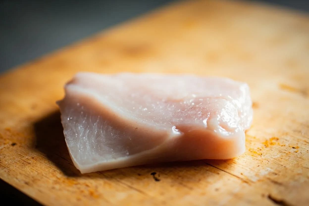 Buri (Yellowtail) Primal Breakdown in its raw whole-cut form on a butcher's board — Buri (鰤, Seriola quinqueradiata) is the Japanese amberjack or yellowtail, a fish whose name, culinary identity, and fat content shift with age and season. Identifying traits: Wild kan-buri (winter yellowtail) from the Hokuriku coast is considered Japan's finest cold-weather fish — fat-rich from migrating south in cold seas, Hamachi toro, the belly of farmed hamachi, has become a standard sushi item globally — rich, mild, and creamy compared to the more assertive wild buri belly, The collar (kama) is meaty, richly flavoured, and self-basting — prized as a grilled izakaya dish.