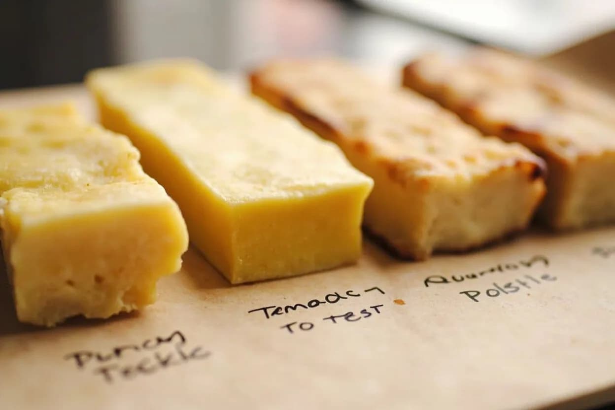 Proof Readiness (Poke Test) in context — the stages just below and above, side-by-side. The poke test is the primary tactile diagnostic for determining whether a shaped dough has proofed sufficiently before baking. Target reference range.