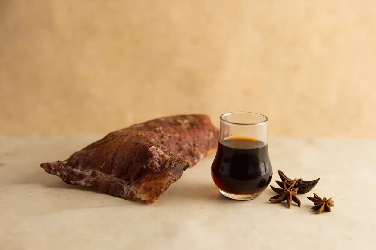 Cassia Bark paired with Soy sauce (Chinese) — the canonical affinity made visible. The umami salinity of soy tempers cassia's astringency and creates the foundational flavor of lu shui (master stock) and red-braised pork.
