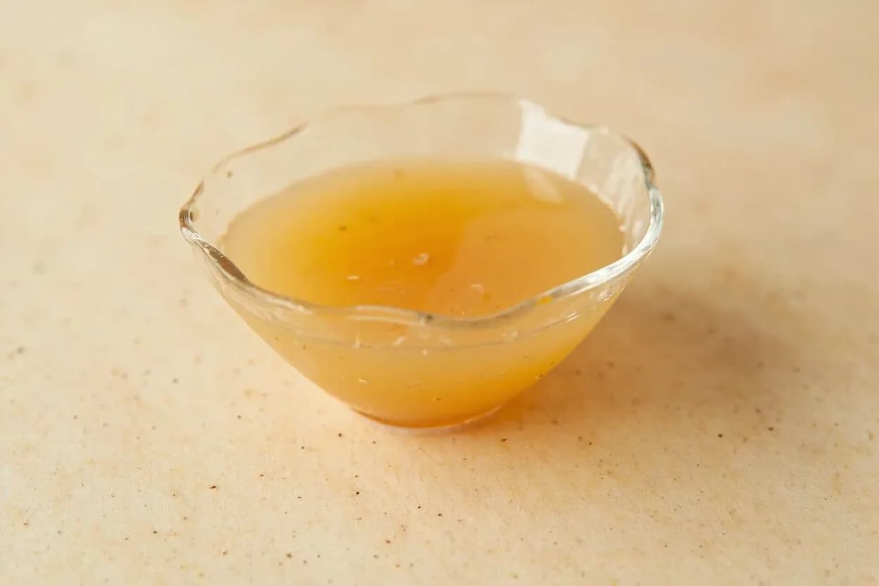 Clam Juice in its natural form. Clam juice is the filtered liquid expelled by steamed clams or extracted from fresh clam meat under pressure. Tasting profile: sharp brine (sodium chloride dominant), iodine and mineral oceanic notes, clean glutamate umami without fishiness, faint sweetness from glycine (free amino acid in bivalves).