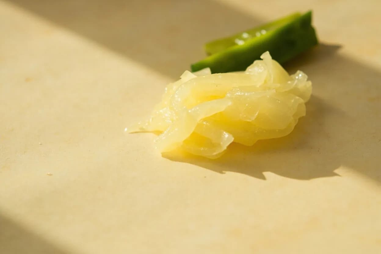 Leche de Tigre in its natural form. Leche de tigre is the liquid left after marinating raw fish and seafood in lime juice to make ceviche. Tasting profile: sharp, bright lime acid (dominant), marine umami from fish proteins and collagen, fruity chile heat (ají amarillo or ají limo), fresh cilantro and celery vegetal lift.