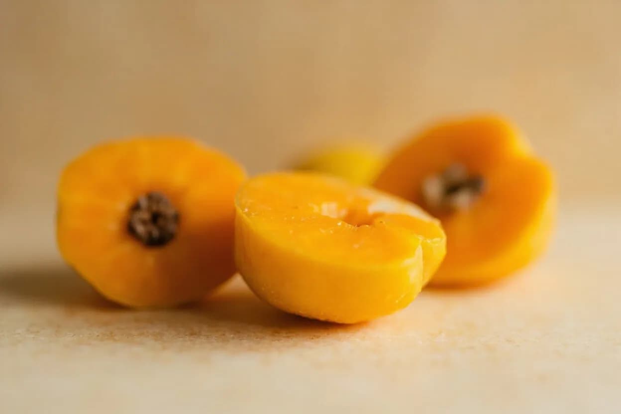 Quince in its natural form. Quince (Cydonia oblonga) is a hard, golden-yellow fruit with a woolly skin that is virtually inedible raw due to its harsh tannins and dense flesh. Tasting profile: Floral rose-and-guava perfume, Sharp, mouth-drying astringency when raw, Honeyed sweetness after cooking, Faint musk and dried-fruit warmth.