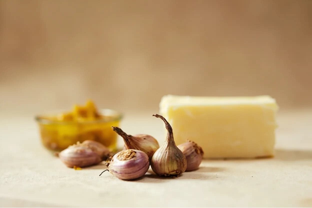 Shallot paired with Dijon mustard (French) — the canonical affinity made visible. The acid and emulsifying power of mustard binds shallot's sharp raw bite in vinaigrettes; together they are the backbone of classic French sauce gribiche and vinaigrette.
