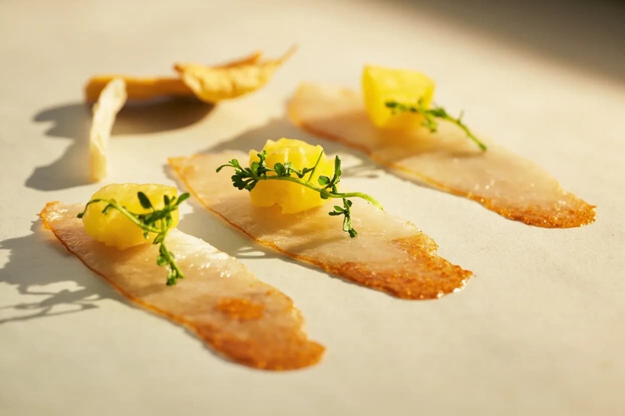 Yuzu paired with Ponzu sauce (Japanese) — the canonical affinity made visible. Yuzu juice is the defining acid in ponzu—combined with soy sauce, mirin, and kombu, it produces Japan's essential citrus-soy condiment for shabu-shabu, tataki, and grilled fish.